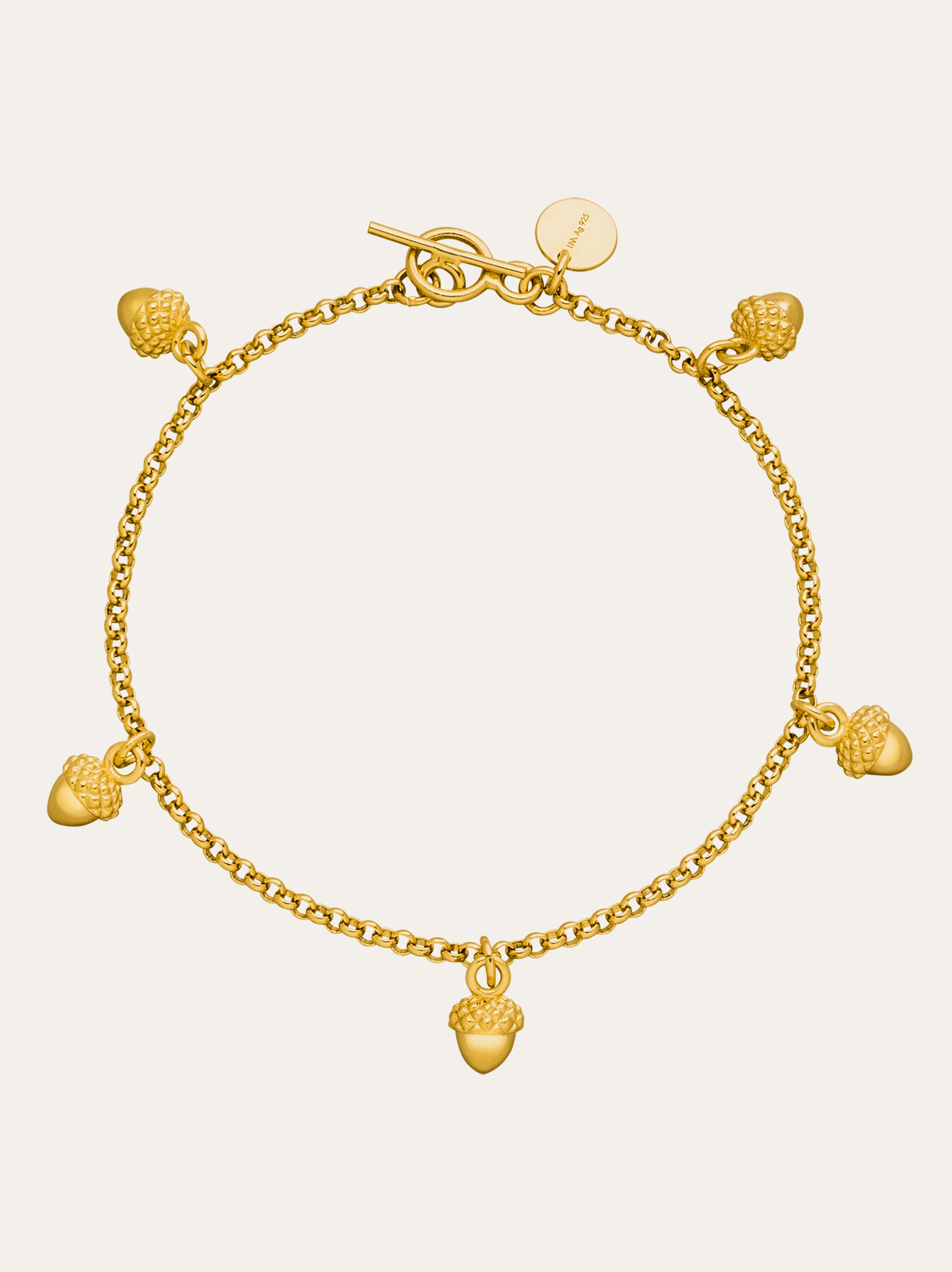"Idamari Gold Plated Acorn Charm Bracelet: 5 lucky acorns on a fine chain."